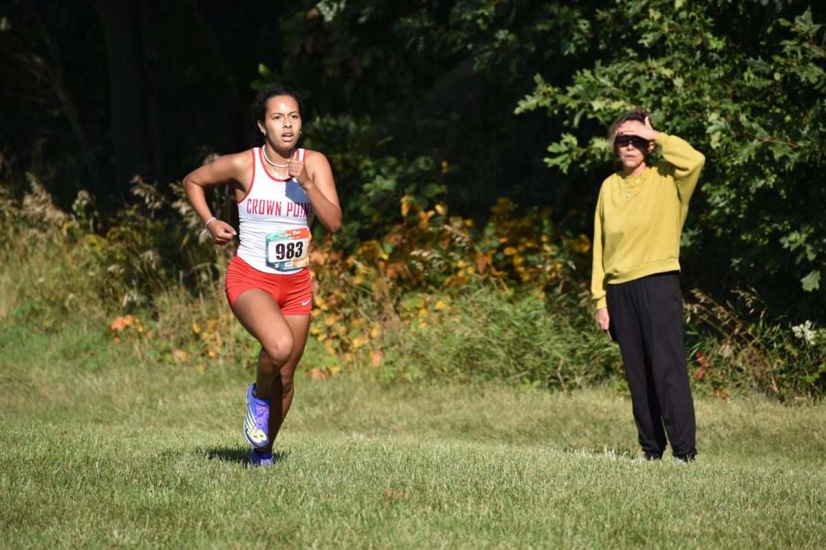 Senior Destiny Lopez runs toward the finish line.