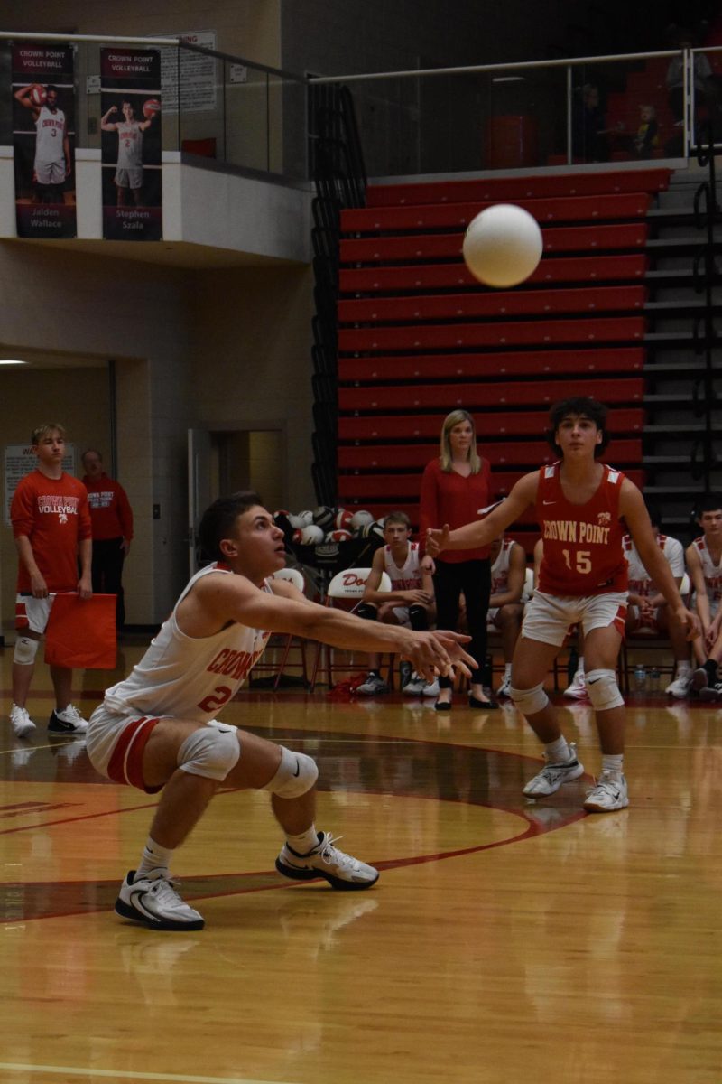 Landon Muller bumps the volleyball to keep it in play