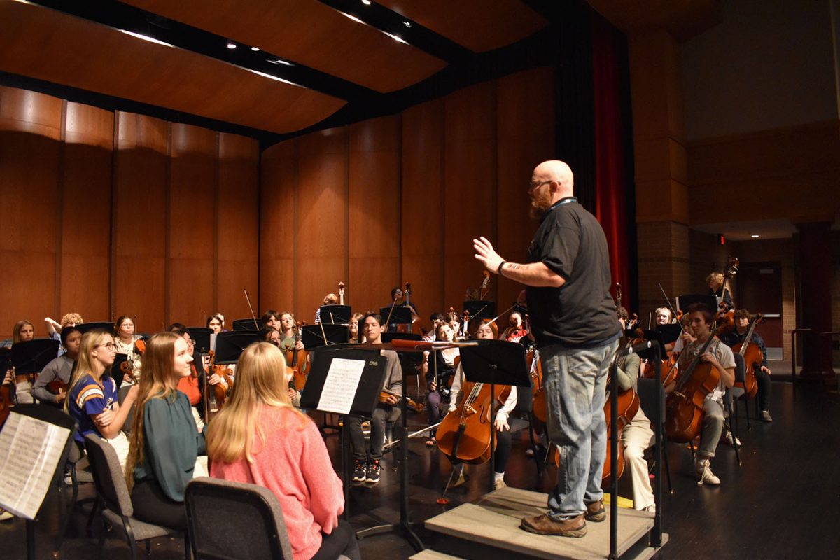 Mr. Zemelko helps the Advanced Orchestra along a complicated piece of music. 