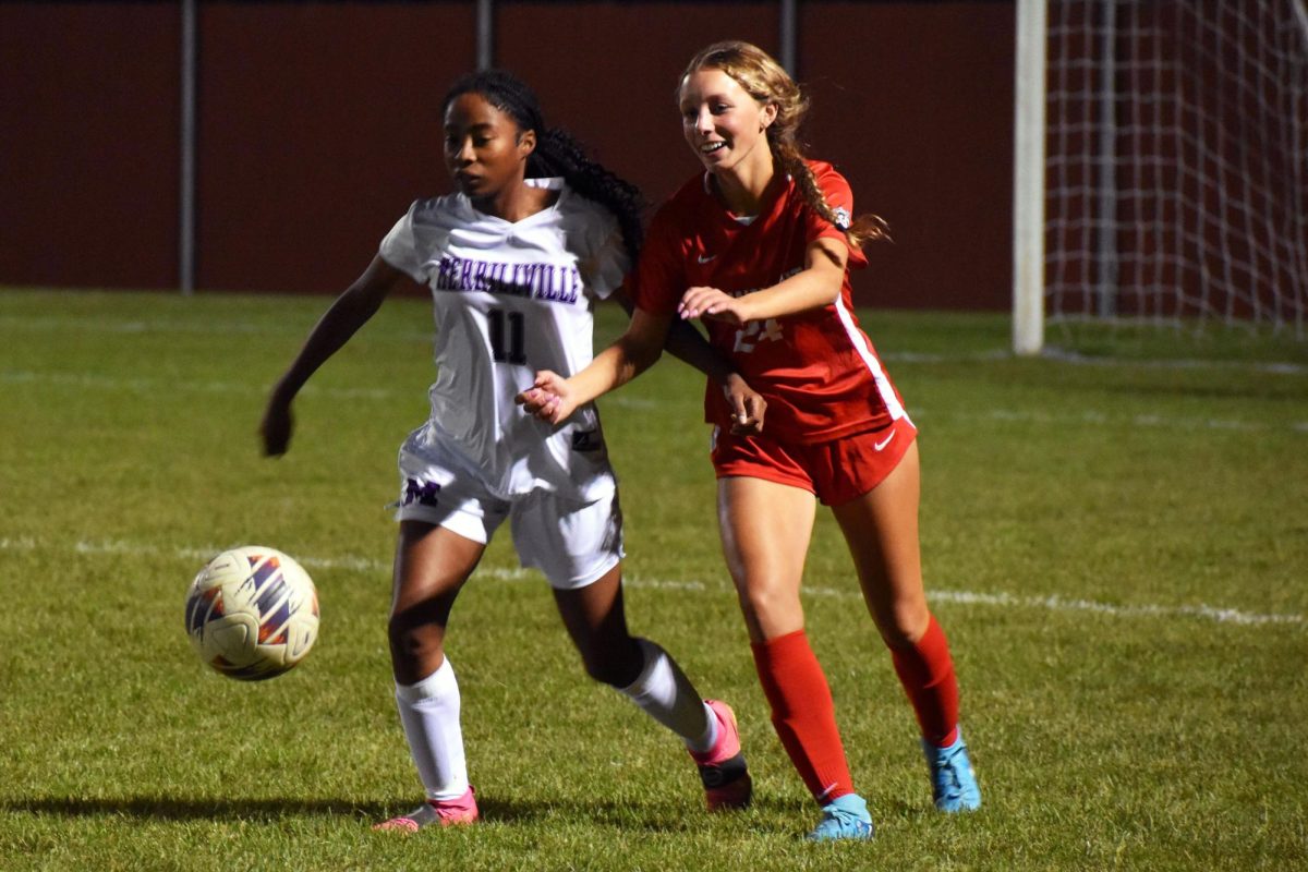 Isabella Sainato (12) chases down a ball.