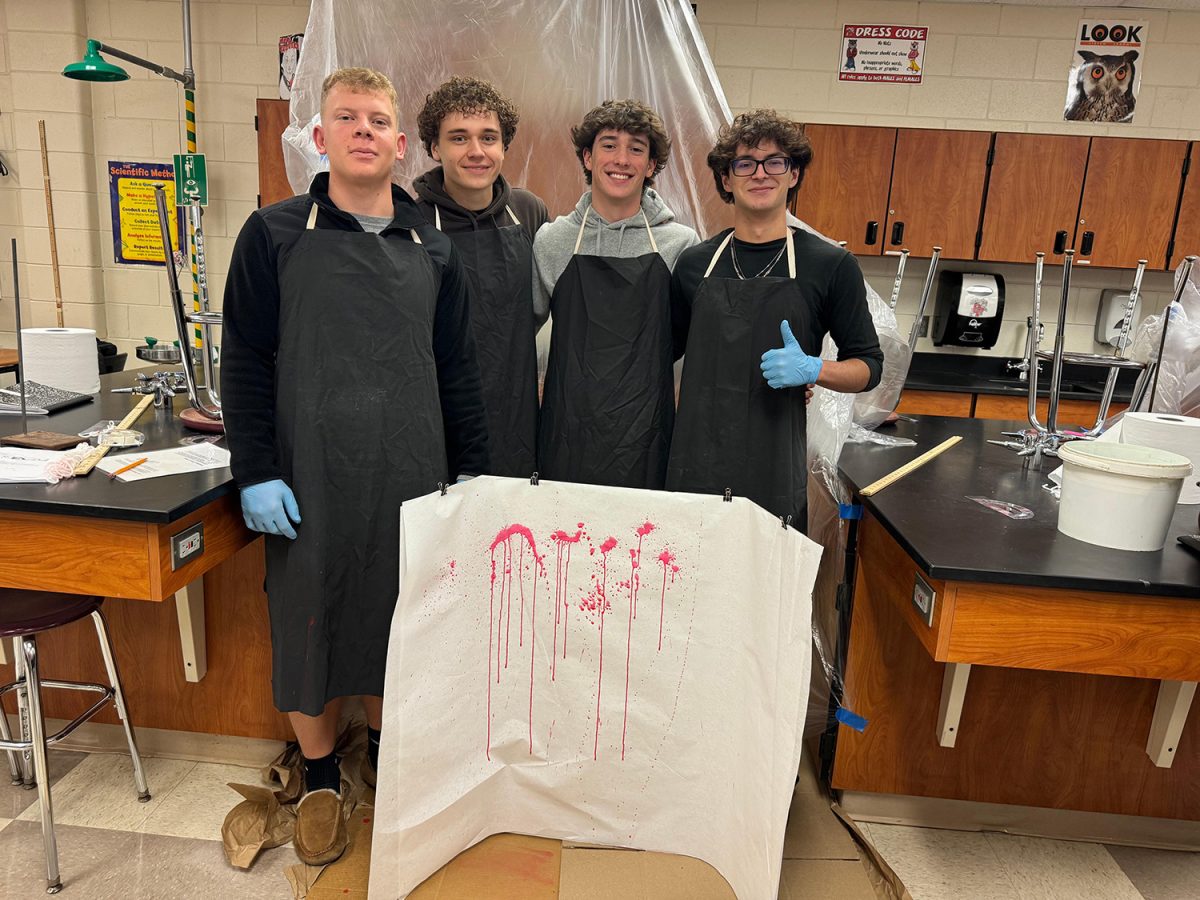 Damian Ugrinoski (11), Wyatt Yonan (11), Nolan Babcock (11), and Christian Bender (11) show off their blood splatters from different angles.