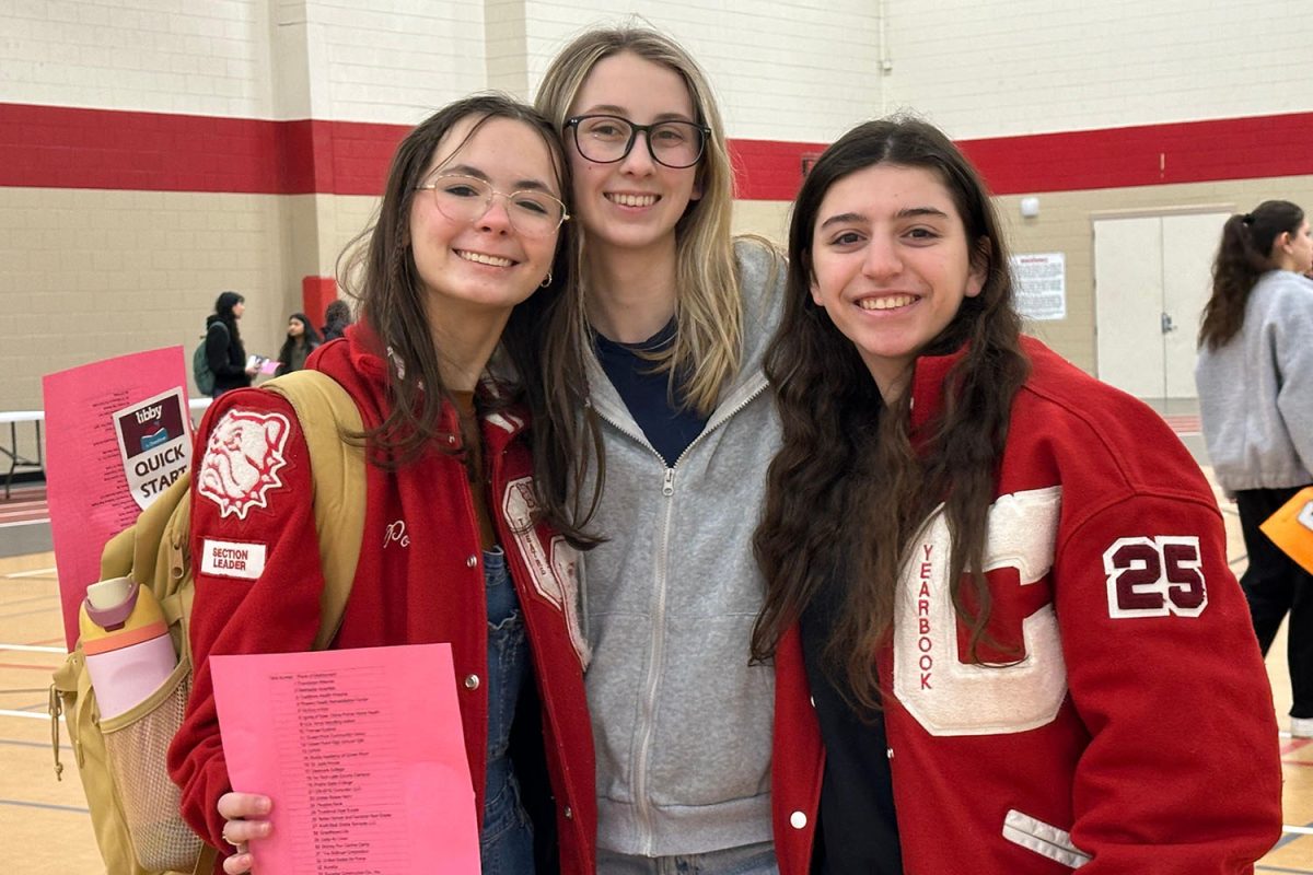 McKenzie Poer (12), Kylee Kleven (12), and Raquel Ruffin (12) attend the career fair together.