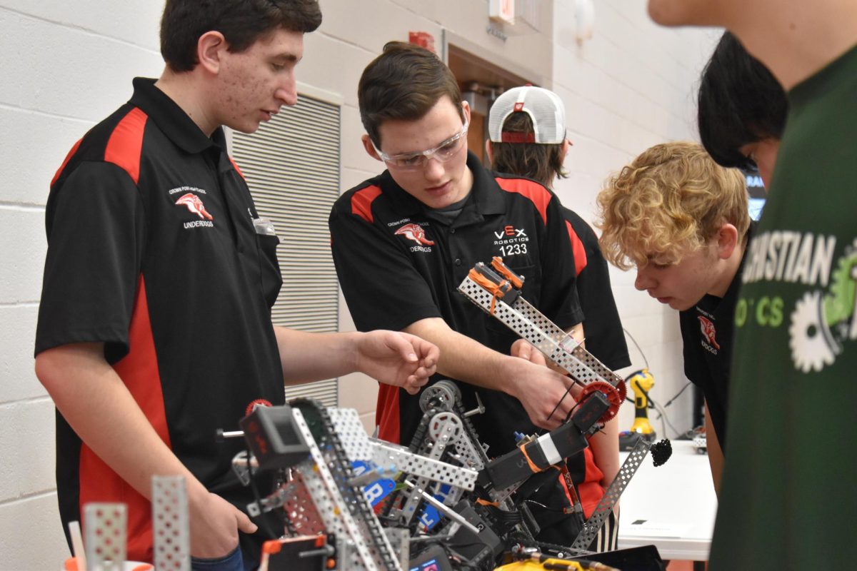 Nicholas Billeck (11) and Caleb Bouton (11) work on their robot.