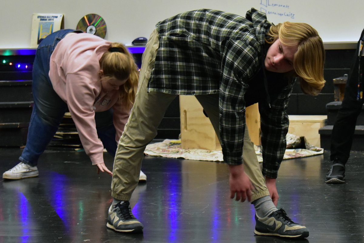 Maddox Jamison (10) stretches and warms up so he can be physical in his scenes.