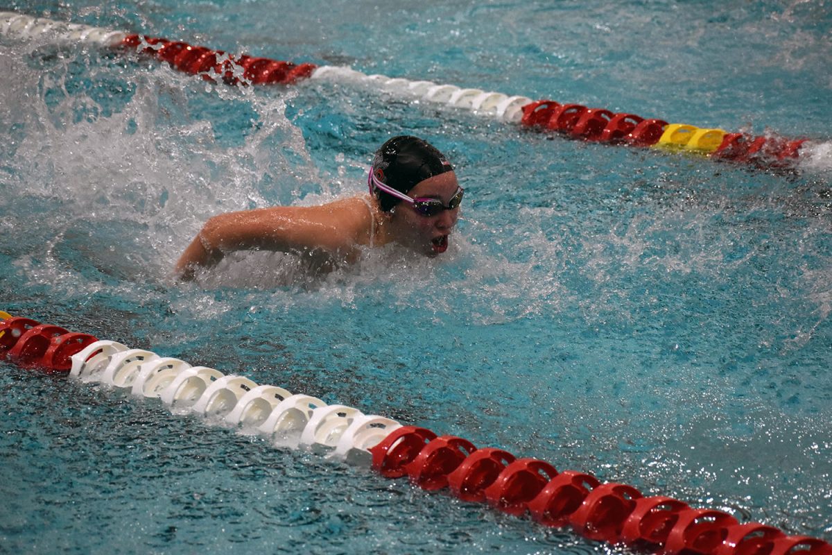 Paetyn Biancotti (10) finishes out her lap while doing butterfly.