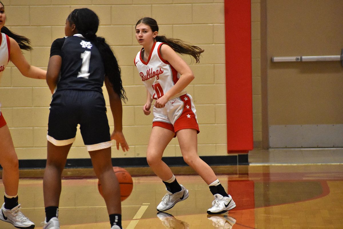 Jillian Brown (12) thinks of a way to get the ball back.