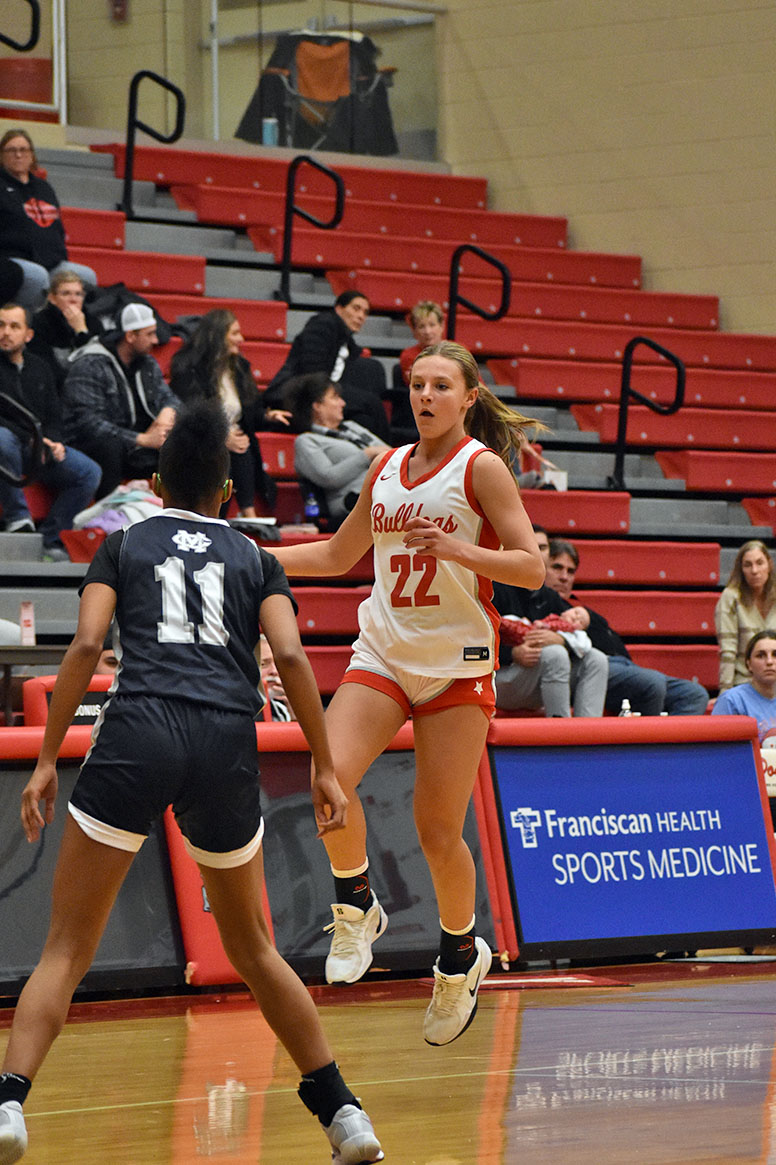 Ava Richie (9) runs past an opposing team member while on defense.