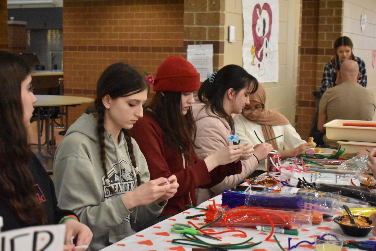 NAHS members make flowers out of pipe cleaners. 