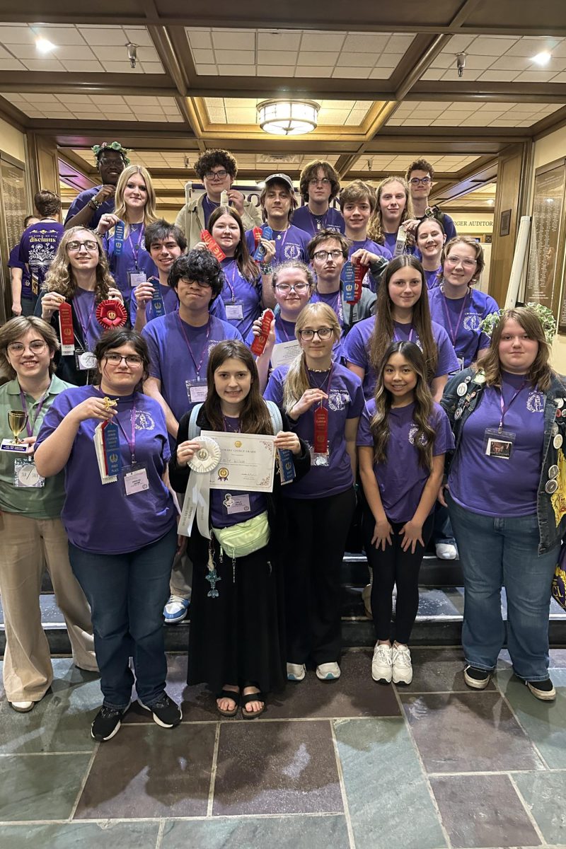 CPHS Latin Club with 2025 state trophies, ribbons, and plaques.