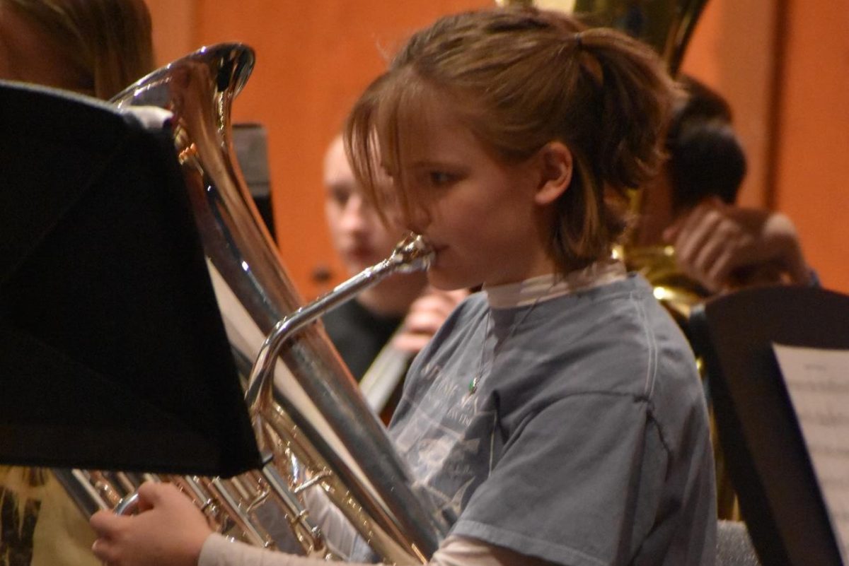 Junior Georgia Hahn rehearses the baritone in preparation for the Holiday Spectacular.