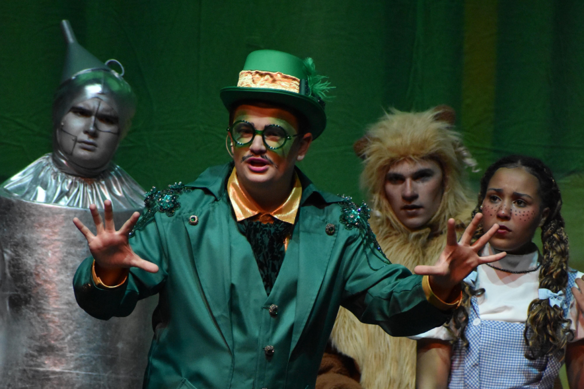 Trent Josleyn, playing the wizard, converses with the crowd.