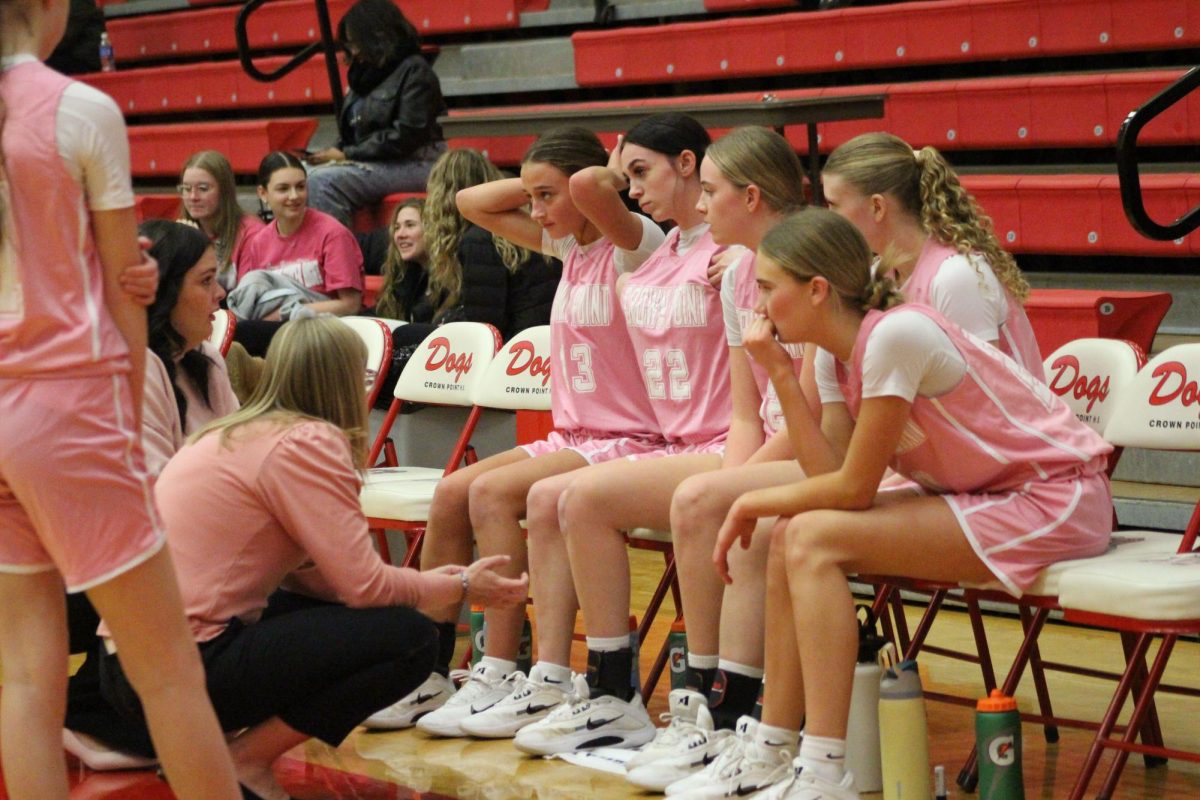 The lady bulldogs' coach speaks with the team during a timeout. 
