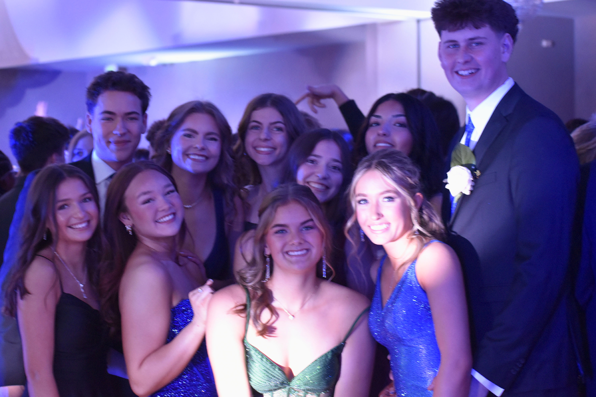 Students take a group photo during the dance.