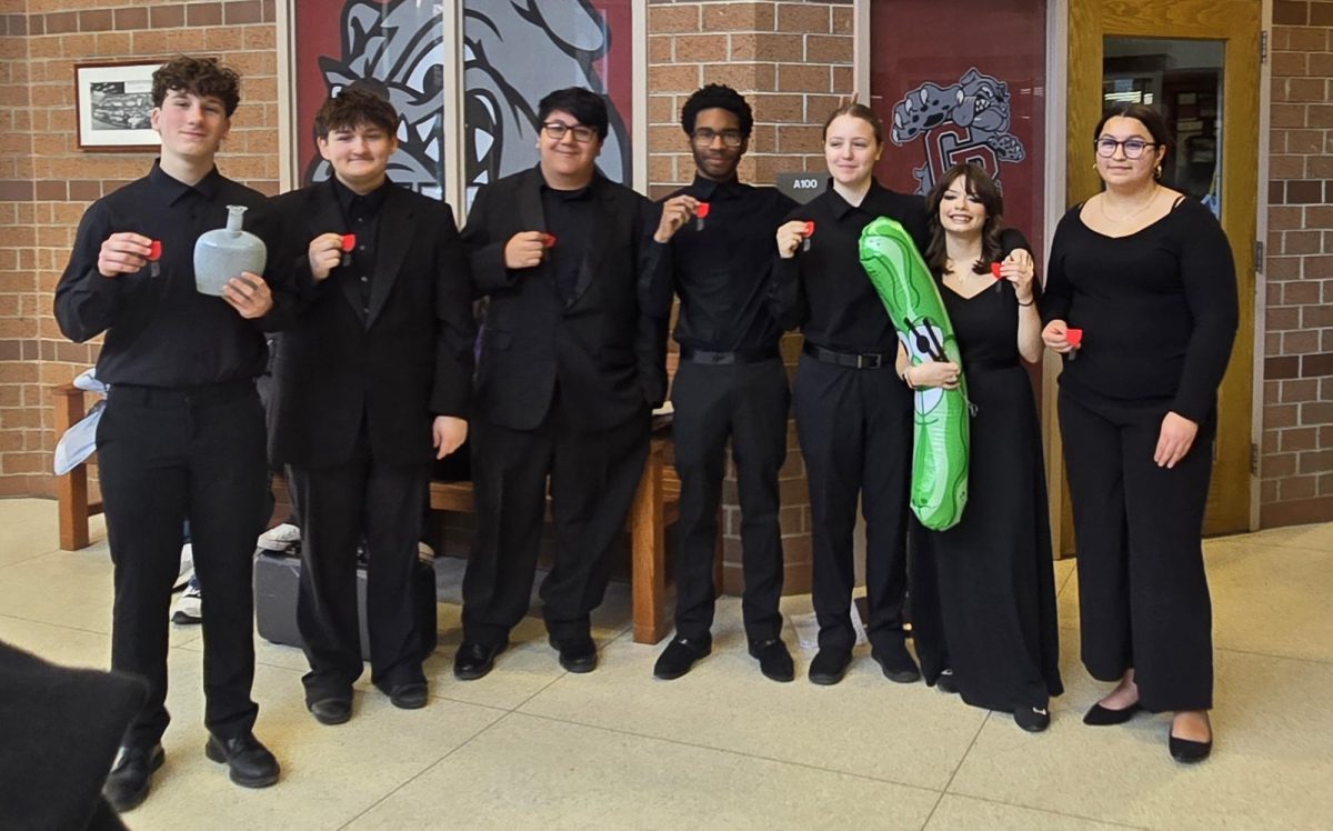The percussion choir poses with their silver medals after their ensemble performance.