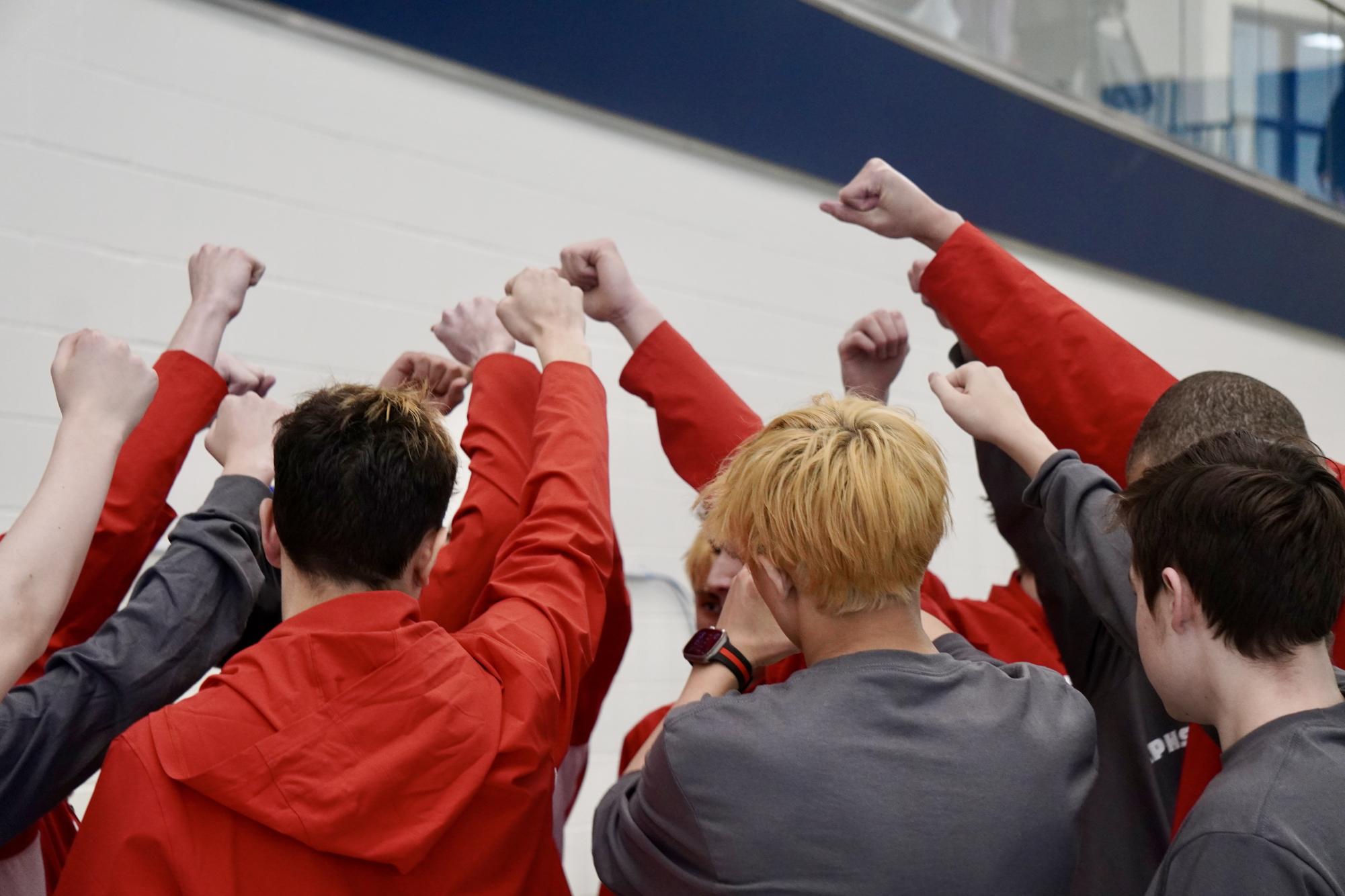 The boys team breaks it down before the meet starts.