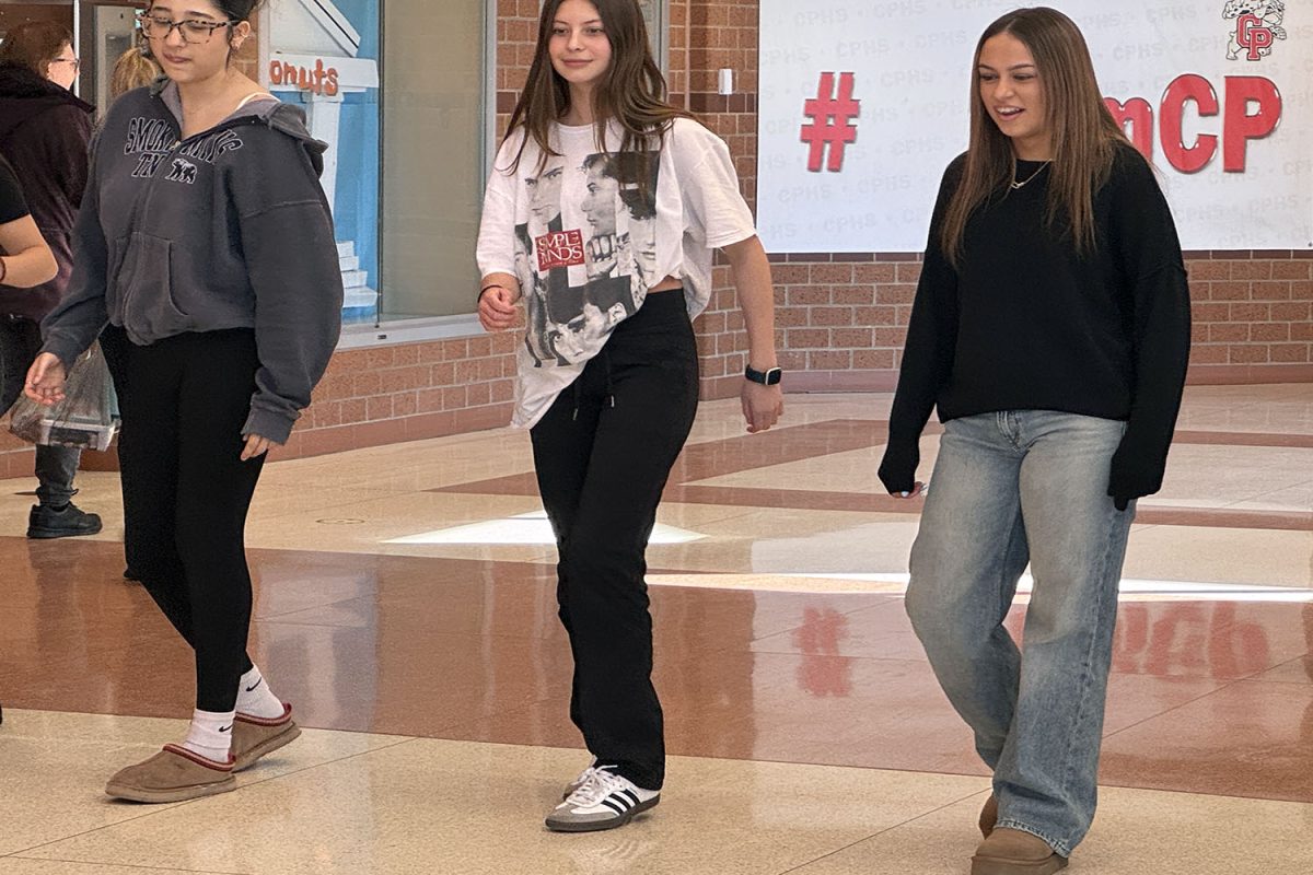 Gisel Magana (12), Dalia Ferguson (12), and Meglena Krsteska (12) learn the Bachata.