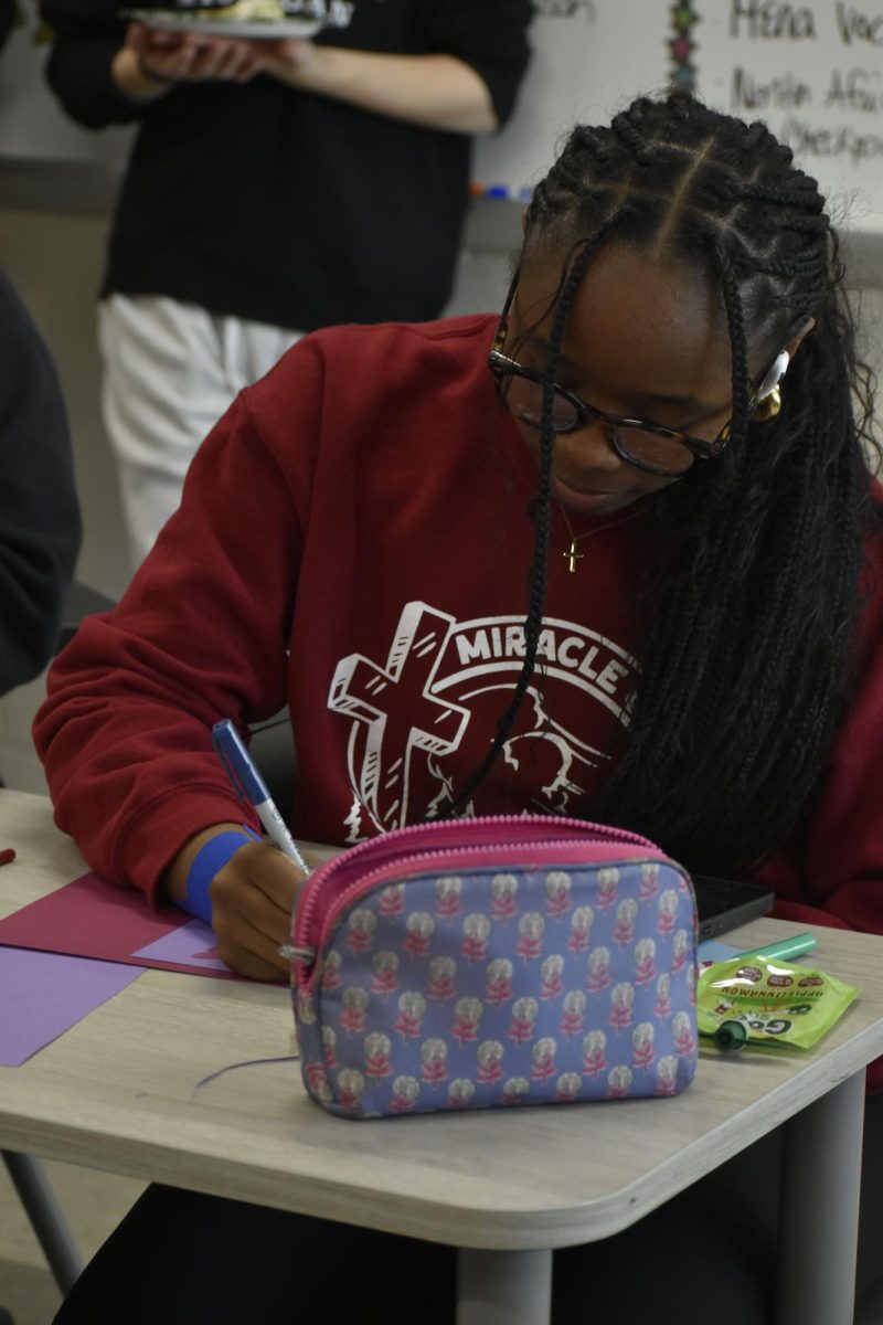 Aubria Harris (11) focuses in on her card during Sending Sunshine.